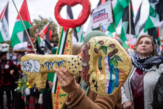 May 16, 2026, Berlin, Berlin, Germany: A Palestinian woman carries a handmade key of return during the Nakba 78 march in Berlin. The key of return is a symbol used by Palestinians to represent their right to return to their homeland. Berlin Germany - ZUMAc291 20260516_zip_c291_003 Copyright: xMariaxCastrox