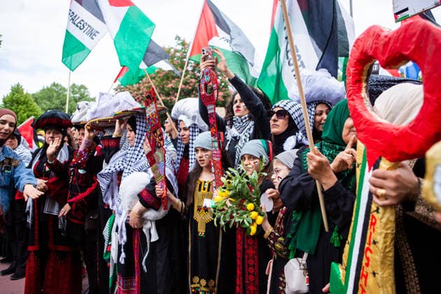 May 16, 2026, Berlin, Berlin, Germany: Women in traditional Palestinian dress take part in the 78th Nakba commemoration march in Berlin, carrying symbolic items and Palestinian flags. Berlin Germany - ZUMAc291 20260516_zip_c291_004 Copyright: xMariaxCastrox