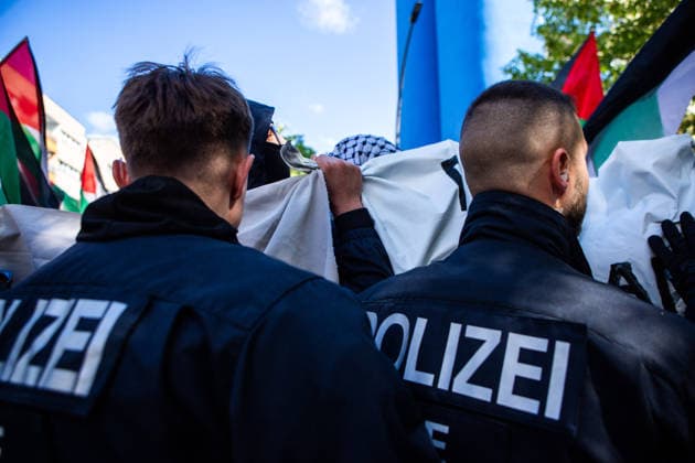 May 16, 2026, Berlin, Berlin, Germany: A tense moment between Berlin police and protesters during the Nakba 78 demonstration in Berlin. Police repeatedly pushed protesters who were trying to protect their identities behind the banners. Berlin Germany  - ZUMAc291 20260516_zip_c291_007 Copyright: xMariaxCastrox