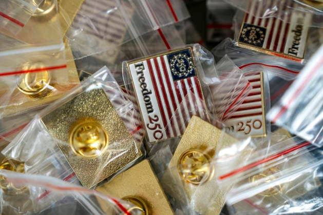 Pins are sold during Rededicate 250 on the National Mall in Washington, DC on Sunday, May 17, 2026. The event, organized by Freedom 250 and the White House Faith Office, will feature political and faith leaders honoring 250 years of American history and encourage prayer or the country s next 250 years.  WAP20260517320 BONNIExCASH