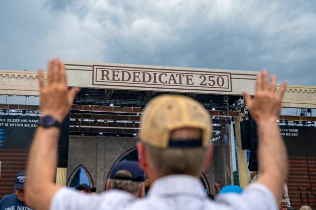 People worship during Rededicate 250 on the National Mall in Washington, DC on Sunday, May 17, 2026. The event, organized by Freedom 250 and the White House Faith Office, will feature political and faith leaders honoring 250 years of American history and encourage prayer or the country s next 250 years.  WAP20260517333 BONNIExCASH