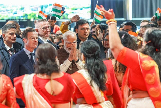 RECORD DATE NOT STATED PM Modi arrives to a warm welcome in Sweden Gothenburg Sweden , May 17 (ANI): Prime Minister Narendra Modi greets the artists as he witnesses a cultural performance during his reception by the Indian diaspora, in Gothenburg on Sunday. Sweden Prime Minister Ulf Kristersson also present. (Narendra Modi Photo gallery ANI Photo) Gothenburg Sweden Copyright: xANIx ANI_20260517440