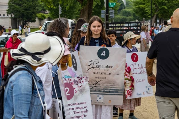 May 17, 2026, Washington, District Of Columbia, USA: Children hold signs espousing Christian values outside the Ã¢â‚¬oeRededicate 250Ã¢â‚¬Â event on the National Mall. Washington USA - ZUMAh196 20260517_znp_h196_006 Copyright: xTomxHudsonx