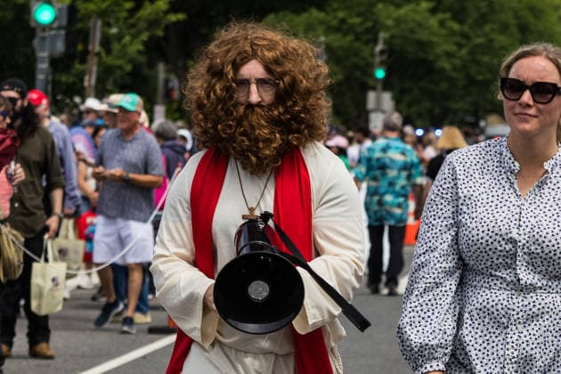 May 17, 2026, Washington, District Of Columbia, USA: A protester dressed as Jesus Christ uses a megaphone to denounce what he describes as behavior antithetical to the teachings of Jesus by members of the Trump administration outside the Ã¢â‚¬oeRededicate 250Ã¢â‚¬Â event on the National Mall. Washington USA - ZUMAh196 20260517_znp_h196_012 Copyright: xTomxHudsonx
