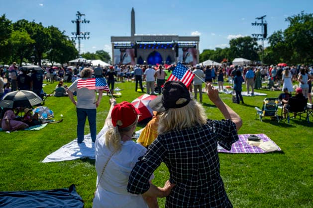 People wave American Flags during Rededicate 250 on the National Mall in Washington, DC on Sunday, May 17, 2026. The event, organized by Freedom 250 and the White House Faith Office, will feature political and faith leaders honoring 250 years of American history and encourage prayer or the country s next 250 years.  WAP20260517342 BONNIExCASH