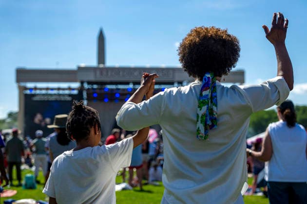 A family worships during Rededicate 250 on the National Mall in Washington, DC on Sunday, May 17, 2026. The event, organized by Freedom 250 and the White House Faith Office, will feature political and faith leaders honoring 250 years of American history and encourage prayer or the country s next 250 years.  WAP20260517343 BONNIExCASH