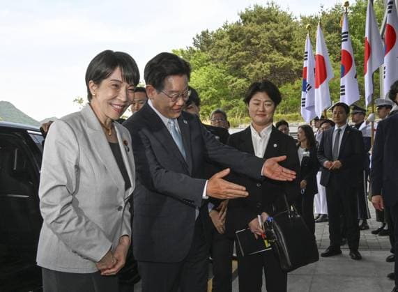Japan-S. Korea summit Japanese Prime Minister Sanae Takaichi (far L) is greeted by South Korean President Lee Jae Myung (2nd from L) before their summit meeting in Andong, South Korea, on May 19, 2026.  A14AA0005582113P