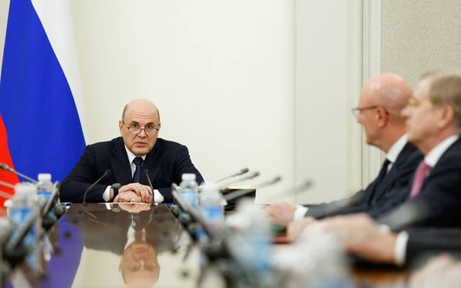 RUSSIA, MOSCOW - MAY 19, 2026: Russia s Prime Minister Mikhail Mishustin (L) holds a meeting with his deputies at the House of the Russian Government. Dmitry Astakhov POOL TASS  92728334