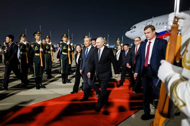 CHINA, BEIJING - MAY 19, 2026: China s Minister of Foreign Affairs Wang Yi and Russia s President Vladimir Putin (L-R centre front) during a ceremony marking Putin s arrival at Beijing Capital International Airport (Shoudu). Russian President Putin s official visit to China coincides with the 25th anniversary of the Treaty of Good-Neighbourliness and Friendly Cooperation Between the People s Republic of China and the Russian Federation, which was signed on 16 July, 2001. Vladimir Smirnov TASS  92745392