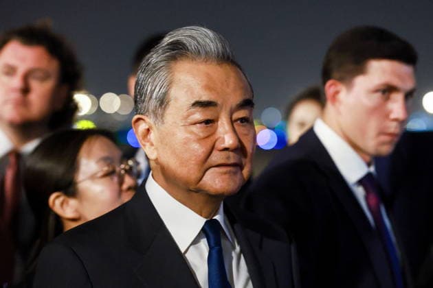 CHINA, BEIJING - MAY 19, 2026: China s Minister of Foreign Affairs Wang Yi (C) during a ceremony marking the arrival of and Russia s President Putin (not pictured) at Beijing Capital International Airport (Shoudu). Russian President Putin s official visit to China coincides with the 25th anniversary of the Treaty of Good-Neighbourliness and Friendly Cooperation Between the People s Republic of China and the Russian Federation, which was signed on 16 July, 2001 Beijing China  - ZUMAt113 20260519_zaa_t113_560 Copyright: xVladimirxSmirnovx