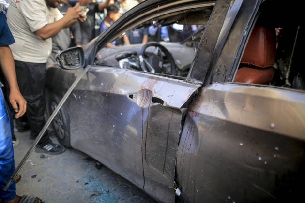 Israeli army targets vehicle in Gaza Strip GAZA CITY, GAZA, PALESTINE - MAY 19: Palestinians inspect a damaged vehicle after an Israeli army strike in the al-Rimal neighborhood of Gaza City, Gaza Strip, Palestine on May 19, 2026. According to reports, one person was killed and four others were injured in the attack targeting the vehicle. Saeed M. M. T. Jaras Anadolu Gaza Palestine. Editorial use only. Please get in touch for any other usage.  Copyright: x2026xAnadoluxSaeedxM.xM.xT.xJarasx
