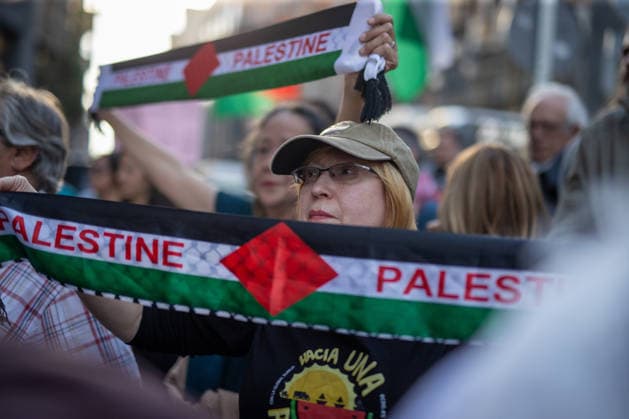 May 19, 2026, Madrid, Spain: Protesters raise Palestinian scarves during a demonstration. A second day of emergency demonstrations in the center of Madrid against the disruption and detention of ships belonging to the Global Sumud Flotilla. The Israeli army has continued to intercept ships from the flotilla that were heading to Gaza with humanitarian aid from various countries. Madrid Spain - ZUMAs197 20260519_aaa_s197_278 Copyright: xDavidxCanalesx