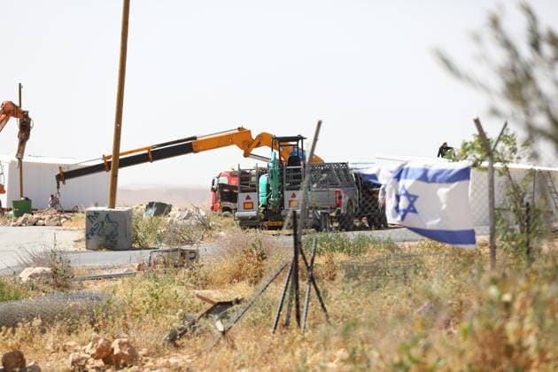 Illegal Israeli settlers expand outpost in West Bank s Umm al-Khair HEBRON, WEST BANK, PALESTINE - MAY 20: Prefabricated houses installed by illegal Israeli settlers are seen under the protection of the Israeli army in the village of Umm al-Khair, located in the Masafer Yatta region south of Hebron in West Bank, Palestine on May 20, 2026. Illegal settlers continue to expand a newly established settlement outpost, seizing Palestinian lands in the area. Wisam Hashlamoun Anadolu Hebron West Bank. Editorial use only. Please get in touch for any other usage.  Copyright: x2026xAnadoluxWisamxHashlamounx