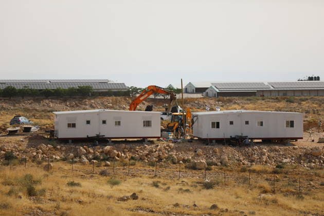 Illegal Israeli settlers expand outpost in West Bank s Umm al-Khair HEBRON, WEST BANK, PALESTINE - MAY 20: Prefabricated houses installed by illegal Israeli settlers are seen under the protection of the Israeli army in the village of Umm al-Khair, located in the Masafer Yatta region south of Hebron in West Bank, Palestine on May 20, 2026. Illegal settlers continue to expand a newly established settlement outpost, seizing Palestinian lands in the area. Wisam Hashlamoun Anadolu Hebron West Bank. Editorial use only. Please get in touch for any other usage.  Copyright: x2026xAnadoluxWisamxHashlamounx