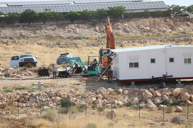 Illegal Israeli settlers expand outpost in West Bank s Umm al-Khair HEBRON, WEST BANK, PALESTINE - MAY 20: Prefabricated houses installed by illegal Israeli settlers are seen under the protection of the Israeli army in the village of Umm al-Khair, located in the Masafer Yatta region south of Hebron in West Bank, Palestine on May 20, 2026. Illegal settlers continue to expand a newly established settlement outpost, seizing Palestinian lands in the area. Wisam Hashlamoun Anadolu Hebron West Bank. Editorial use only. Please get in touch for any other usage.  Copyright: x2026xAnadoluxWisamxHashlamounx