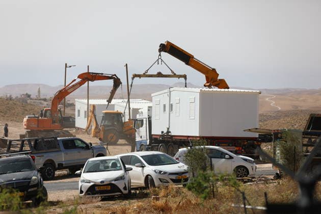 Illegal Israeli settlers expand outpost in West Bank s Umm al-Khair HEBRON, WEST BANK, PALESTINE - MAY 20: Prefabricated houses installed by illegal Israeli settlers are seen under the protection of the Israeli army in the village of Umm al-Khair, located in the Masafer Yatta region south of Hebron in West Bank, Palestine on May 20, 2026. Illegal settlers continue to expand a newly established settlement outpost, seizing Palestinian lands in the area. Wisam Hashlamoun Anadolu Hebron West Bank. Editorial use only. Please get in touch for any other usage.  Copyright: x2026xAnadoluxWisamxHashlamounx