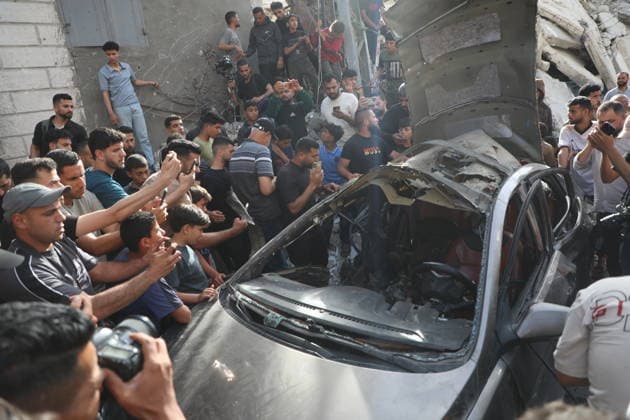 Palestinians Gather at Site of Israeli Strike in Gaza City others. May 20, 2026: Palestinians Gather at Site of Israeli Strike in Gaza City Palestinians gather at the site of an Israeli airstrike that targeted a vehicle on al-Shuhada Street in Gaza City, on May 19, 2026. According to local sources, the strike killed one person and wounded several others. Copyright: xx