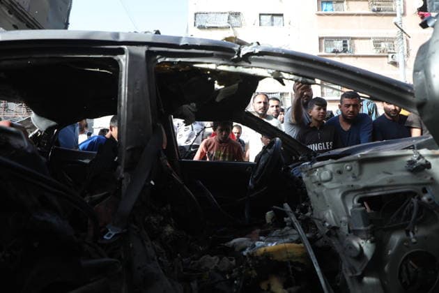 Palestinians Gather at Site of Israeli Strike in Gaza City others. May 20, 2026: Palestinians Gather at Site of Israeli Strike in Gaza City Palestinians gather at the site of an Israeli airstrike that targeted a vehicle on al-Shuhada Street in Gaza City, on May 19, 2026. According to local sources, the strike killed one person and wounded several others. Copyright: xx