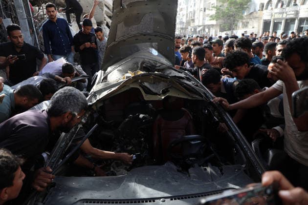 Palestinians Gather at Site of Israeli Strike in Gaza City others. May 20, 2026: Palestinians Gather at Site of Israeli Strike in Gaza City Palestinians gather at the site of an Israeli airstrike that targeted a vehicle on al-Shuhada Street in Gaza City, on May 19, 2026. According to local sources, the strike killed one person and wounded several others. Copyright: xx