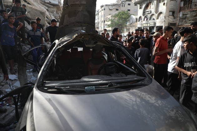 Palestinians Gather at Site of Israeli Strike in Gaza City others. May 20, 2026: Palestinians Gather at Site of Israeli Strike in Gaza City Palestinians gather at the site of an Israeli airstrike that targeted a vehicle on al-Shuhada Street in Gaza City, on May 19, 2026. According to local sources, the strike killed one person and wounded several others. Copyright: xx