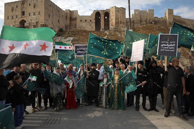 Syrian Circassians commemorate to mark the 162nd anniversary of their exile in Aleppo ALEPPO, SYRIA - MAY 21: Circassians gather to commemorate the 162nd anniversary of the 1864 Circassian Exile, holding memorial events and honoring those who lost their lives during the deportation, on May 21, 2026, in Aleppo, Syria. Participants held a moment of silence in front of the Aleppo Citadel, wearing black T-shirts and traditional Circassian clothing while carrying Circassian and Syrian flags. Kasim Yusuf Anadolu Aleppo Syria. Editorial use only. Please get in touch for any other usage.  Copyright: x2026xAnadoluxKasimxYusufx