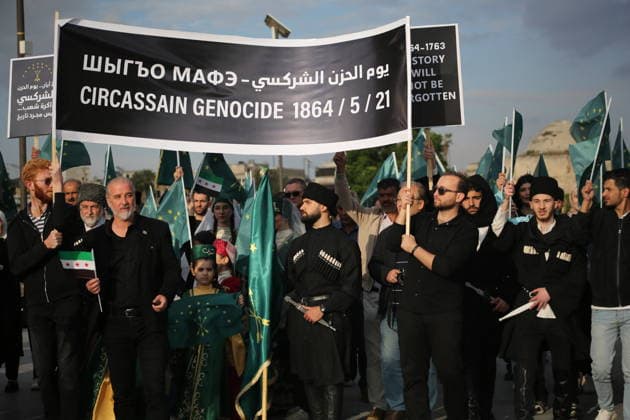 Syrian Circassians commemorate to mark the 162nd anniversary of their exile in Aleppo ALEPPO, SYRIA - MAY 21: Circassians gather to commemorate the 162nd anniversary of the 1864 Circassian Exile, holding memorial events and honoring those who lost their lives during the deportation, on May 21, 2026, in Aleppo, Syria. Participants held a moment of silence in front of the Aleppo Citadel, wearing black T-shirts and traditional Circassian clothing while carrying Circassian and Syrian flags. Kasim Yusuf Anadolu Aleppo Syria. Editorial use only. Please get in touch for any other usage.  Copyright: x2026xAnadoluxKasimxYusufx