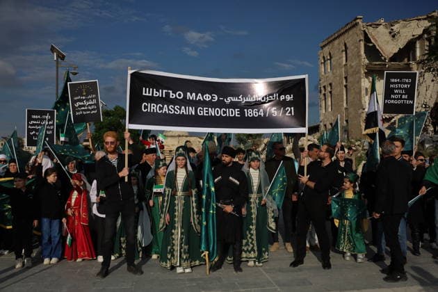 Syrian Circassians commemorate to mark the 162nd anniversary of their exile in Aleppo ALEPPO, SYRIA - MAY 21: Circassians gather to commemorate the 162nd anniversary of the 1864 Circassian Exile, holding memorial events and honoring those who lost their lives during the deportation, on May 21, 2026, in Aleppo, Syria. Participants held a moment of silence in front of the Aleppo Citadel, wearing black T-shirts and traditional Circassian clothing while carrying Circassian and Syrian flags. Kasim Yusuf Anadolu Aleppo Syria. Editorial use only. Please get in touch for any other usage.  Copyright: x2026xAnadoluxKasimxYusufx