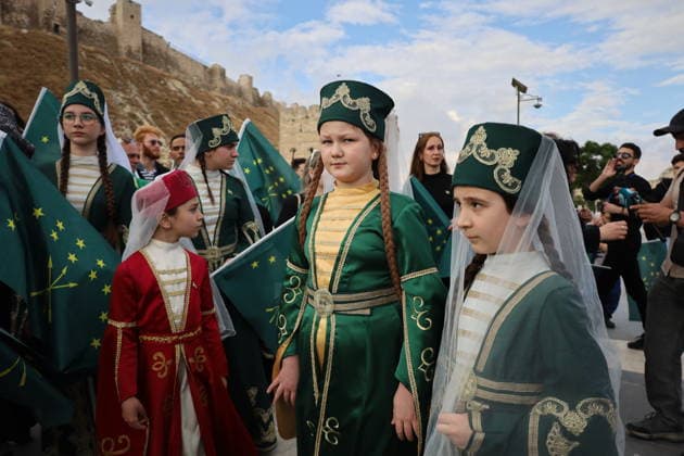 Syrian Circassians commemorate to mark the 162nd anniversary of their exile in Aleppo ALEPPO, SYRIA - MAY 21: Circassians gather to commemorate the 162nd anniversary of the 1864 Circassian Exile, holding memorial events and honoring those who lost their lives during the deportation, on May 21, 2026, in Aleppo, Syria. Participants held a moment of silence in front of the Aleppo Citadel, wearing black T-shirts and traditional Circassian clothing while carrying Circassian and Syrian flags. Kasim Yusuf Anadolu Aleppo Syria. Editorial use only. Please get in touch for any other usage.  Copyright: x2026xAnadoluxKasimxYusufx