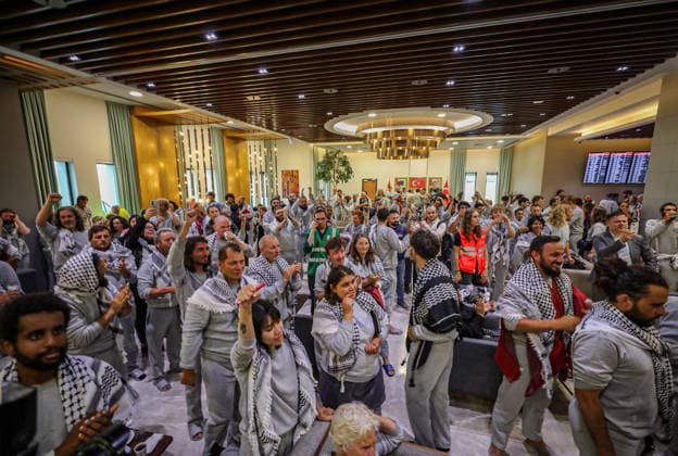 May 21, 2026, Istanbul, Istanbul, To¼rkiye: Released participants of the Freedom Flotilla arrive at Istanbul Airport after being detained by Israeli forces while attempting to break the siege on Gaza and deliver humanitarian aid. Activists, supporters, and members of the public gathered at the airport to welcome them back with flowers, applause, Palestinian flags, and chants of solidarity, celebrating their safe return and their mission of humanitarian resistance against the blockade on Gaza, in Istanbul, To¼rkiye, on May 21, 2026. Istanbul Türkiye - ZUMAa268 20260521_zip_a268_010 Copyright: xAbdelrahmanxAlkahloutx