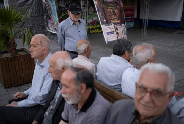Daily Life In Iran Amid Threat About New Possible War Elderly Iranian men sit together on a sidewalk in a business district in downtown Tehran, Iran, on May 22, 2026. U.S. President Donald Trump threatens Iran with the possibility of a new conflict, with reports indicating he is considering military action if no agreement is reached with Iranian officials. Tehran Tehran Iran  Copyright: xMortezaxNikoubazlx originalFilename: nikoubazl-dailylif260522_nphKS