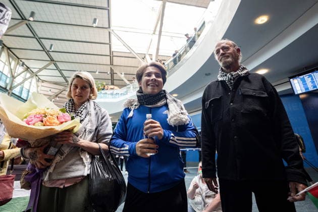 May 24, 2026, Vancouver, Bc, CANADA: Mary Grace Mathisen, left to right, Sebastian Tow, and Michael France, members of the Gaza bound flotilla which was detained by Israel, arrive at the Vancouver International Airport in Richmond B.C., on Sunday, May 24, 2026. Vancouver CANADA - ZUMAc35_ 20260524_zaf_c35_158 Copyright: xEthanxCairnsx