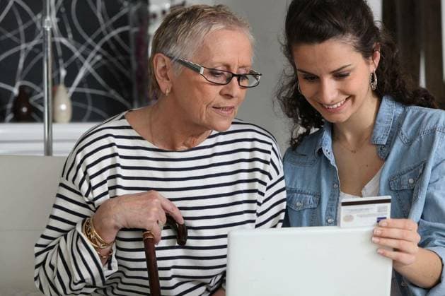 grandma and home helper with laptop model released Symbolfoto Copyright: xphovoirx Panthermedia67660764.jpg