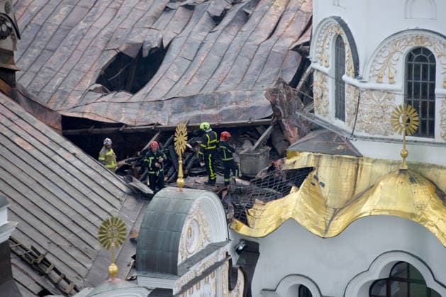 A firefighter works on the roof of the Dormition Cathedral at the Kyiv Pechersk Lavra that caught fire during a massive Russian combined attack, Kyiv, Ukraine, June 15, 2026. The Russian army launched a large-scale assault on the Ukrainian capital with missiles and strike drones, killing four people and injuring 28, including children and a pregnant woman. At least 140,000 consumers were left without electricity due to damage to power grids. Residential buildings, the Kyiv Pechersk Lavra, the Mystetskyi Arsenal Museum Complex, the Dovzhenko Film Studio, and the building of the High Anti-Corruption Court sustained damage. (Photo by Marianna Kotyk Ukrinform) Massive Russian attack damages Kyiv Pechersk Lavra and Mystetskyi Arsenal in Kyiv Copyright: xMariannaxKotykx