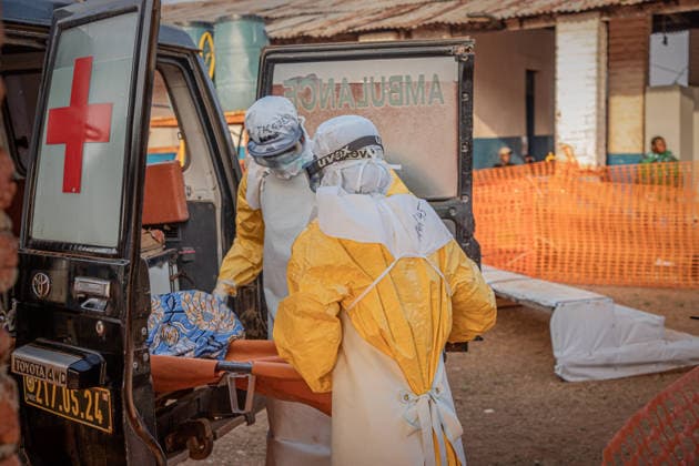(260624) -- KINSHASA, June 24, 2026 -- Medical workers escort an Ebola patient to an Ebola treatment center in Mongbwalu, Ituri Province, the Democratic Republic of the Congo, June 20, 2026. The Democratic Republic of the Congo (DRC) has reported 1,094 confirmed Ebola cases, including 277 deaths, in the current outbreak declared on May 15, with the World Health Organization (WHO) registering a record first-month caseload. Official data released Tuesday showed 387 cases were under quarantine or receiving treatment, and 115 recoveries. DRC authorities have also reported 131 suspected cases, including 44 suspected deaths. DR CONGO-ITURI-EBOLA ShixYu
