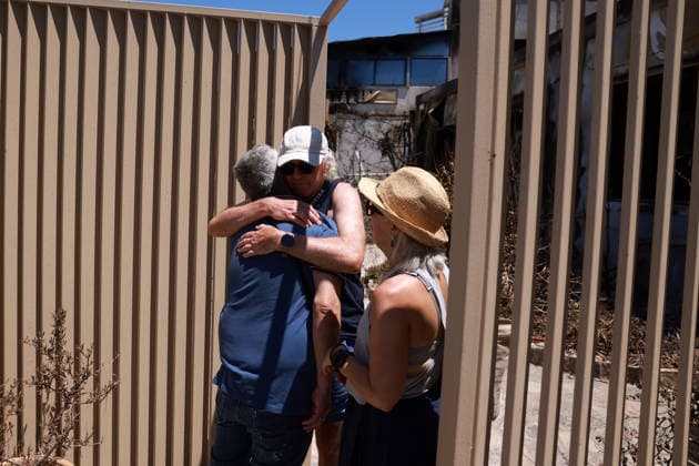 Aftermath of the devastating Crete wildfire CRETE, GREECE - JULY 31: Vangelis Datseris, the receptionist of a hotel damaged by the wildfire, is embraced by guests after a wildfire at the village of Agios Pavlos, in the Rethymno region on the island of Crete, Greece, July 31, 2026. Costas Baltas Anadolu Crete Greece. Editorial use only. Please get in touch for any other usage.  Copyright: x2026xAnadoluxCostasxBaltasx