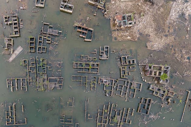July 31, 2026, Lebak Regency, Banten, Indonesia: An aerial view shows the ruins of Somang village, which have re-emerged as water levels recede during the dry season, amid forecasts that El Nio±o may contribute to drier-than-normal conditions, at Karian Reservoir in Sajira district, Lebak Regency, Banten province, Indonesia, July 31, 2026. Lebak Regency Indonesia - ZUMAp283 20260731_zip_p283_026 Copyright: xClaudioxPramanax