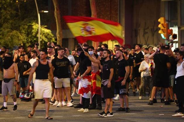 Far-right demonstration outside Moroccan Embassy in Barcelona BARCELONA, SPAIN JULY 31, 2026: Participants attend a demonstration outside the Moroccan Embassy in Barcelona following recent migration developments at Spain s North African enclave of Ceuta. Demonstrators wave Spanish flags, display banners and chant slogans during the protest, while some participants are seen making gestures commonly associated with Nazi salutes. Barcelona Spain Copyright: x xPabloxCarvajalxMunizagax xJNAxPressx