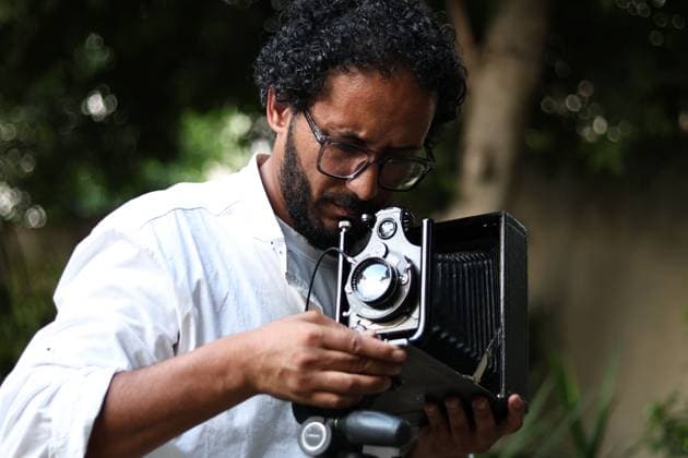 July 31, 2026, Cairo, Egypt: CAIRO, EGYPT Ã¢â‚¬ JULY 2026: Egyptian photojournalist Fareed Kotb poses with his restored 1930 Zeiss Ikon camera in Cairo, Egypt. Kotb gained international recognition for using the nearly century-old camera during his Project 1930, documenting the FIFA World Cup 2026 with a vintage camera manufactured in the same year as the inaugural FIFA World Cup. Cairo Egypt  - ZUMAq101 20260731_zna_q101_230 Copyright: xAbdullahxHamadax