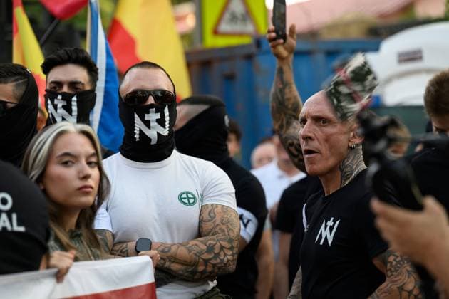 July 31, 2026, Madrid, Spain: MADRID, SPAIN Ã¢â‚¬ JULY 31, 2026: Participants attend a demonstration outside the Moroccan Embassy in Madrid, called by the far-right groups Falange EspaoÂ±ola and NoÂºcleo Nacional, following recent migrant arrivals through Spain s North African enclave of Ceuta. Protesters wave Spanish flags, display banners and chant slogans during the demonstration, while some participants are seen making gestures commonly associated with Nazi salutes. Madrid Spain - ZUMAq101 20260731_zna_q101_222 Copyright: xTomasxCallex