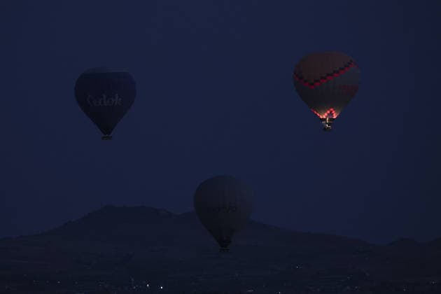 7th Cappadocia Balloon Festival NEVSEHIR, TURKIYE - AUGUST 01: Figure-shaped hot air balloons float above Cappadocia s fairy chimneys during the seventh Cappadocia Balloon Festival, on August 01, 2026 in Nevsehir, Turkiye. Organized by the Ministry of Culture and Tourism, the festival features 30 specially designed balloons brought from Turkiye and several other countries. During sunrise demonstration flights over Goreme, balloons shaped like hearts, owls, parrots, rockets and the Earth attracted the attention of local and international visitors. Osmancan Gurdogan Anadolu Nevsehir Turkey. Editorial use only. Please get in touch for any other usage.  Copyright: x2026xAnadoluxOsmancanxGurdoganx