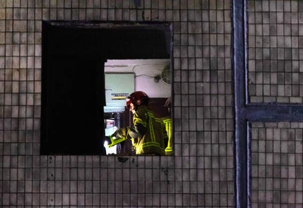 State Emergency Service rescuers force open the jammed entrance door to a flat in a five-storey apartment block in the Solomianskyi district that was partially destroyed by an overnight Russian strike, Kyiv, Ukraine, August 1, 2026. The attack caused partial collapse and fire in the building. Rescue workers evacuated 35 residents from the upper floors. Two people were killed and eight injured. (Photo by Kyrylo Chubotin Ukrinform) Russian attack damages apartment block in Kyiv’s Solomianskyi district  Copyright: xKyryloxChubotinx