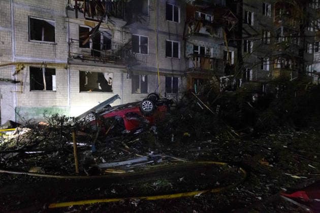 An overturned car, flipped by the shock wave, lies beside a five-storey apartment block partially destroyed in an overnight Russian strike in the Solomianskyi district, Kyiv, Ukraine, August 1, 2026. The attack caused partial collapse and fire in the building. Rescue workers evacuated 35 residents from the upper floors. Two people were killed and eight injured. (Photo by Kyrylo Chubotin Ukrinform) Russian attack damages apartment block in Kyiv’s Solomianskyi district  Copyright: xKyryloxChubotinx