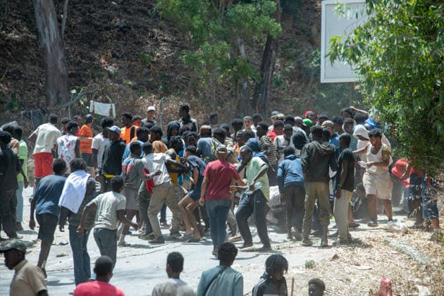 August 1, 2026, Ceuta, Ceuta, Spain: Migrants fight for food near the CETI temporary stay centre. Ceuta Spain - ZUMAd308 20260801_zsp_d308_071 Copyright: xJuanxCarlosxLucasx