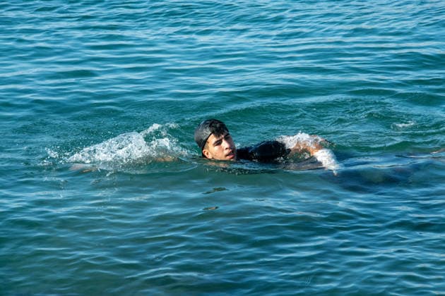 August 2, 2026, Ceuta, Madrid, Spain: A migrant attempts to swim across the border under the watchful eye of the Spanish Civil Guard at El Tarajal beach in Ceuta, Spain, August 2, 2026. Ceuta Spain - ZUMAd308 20260802_zsp_d308_008 Copyright: xJuanxCarlosxLucasx