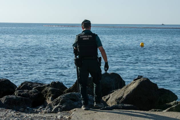 August 2, 2026, Ceuta, Madrid, Spain: A migrant attempts to swim across the border under the watchful eye of the Spanish Civil Guard at El Tarajal beach in Ceuta, Spain, August 2, 2026. Ceuta Spain  - ZUMAd308 20260802_zsp_d308_014 Copyright: xJuanxCarlosxLucasx