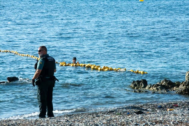 August 2, 2026, Ceuta, Madrid, Spain: A migrant attempts to swim across the border under the watchful eye of the Spanish Civil Guard at El Tarajal beach in Ceuta, Spain, August 2, 2026. Ceuta Spain  - ZUMAd308 20260802_zsp_d308_019 Copyright: xJuanxCarlosxLucasx