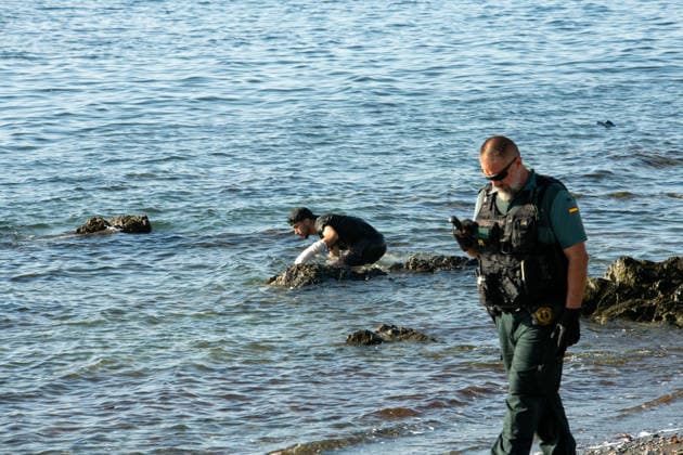 August 2, 2026, Ceuta, Madrid, Spain: A migrant attempts to swim across the border under the watchful eye of the Spanish Civil Guard at El Tarajal beach in Ceuta, Spain, August 2, 2026. Ceuta Spain - ZUMAd308 20260802_zsp_d308_033 Copyright: xJuanxCarlosxLucasx