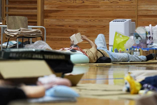 Aftermath of strong earthquake in Kumamoto An evacuee rests at an evacuation center in Uki in Kumamoto Prefecture, southwestern Japan, on Aug. 1, 2026, after a powerful earthquake struck the region on July 28.  A14AA0005624891P