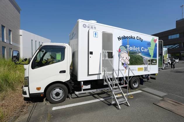 Aftermath of strong earthquake in Kumamoto Photo taken on Aug. 1, 2026, shows a toilet car parked in Uki in Kumamoto Prefecture, southwestern Japan, after a powerful earthquake struck the region on July 28.  A14AA0005624897P