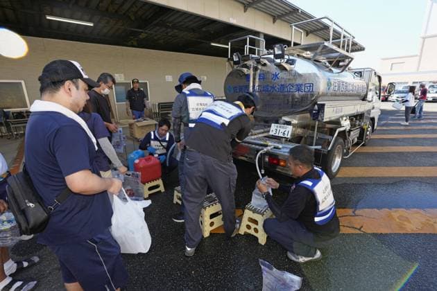 Aftermath of strong earthquake in Kumamoto People collect water from a water truck at the city hall of Uki, Kumamoto Prefecture, southwestern Japan, on Aug. 1, 2026, after a powerful earthquake struck the region on July 28.  A14AA0005624916P